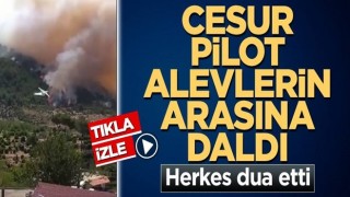 Cesur pilot canını hiçe saydı! İnsanları korumak için alevlerin içine daldı