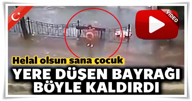 Fırtınada yere düşen bayrağı böyle kaldırdı