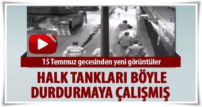 Halk darbecilerin tankını üzerine örtü örterek durdurmaya çalışmış